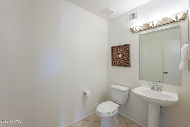 bathroom featuring visible vents, baseboards, toilet, and tile patterned flooring