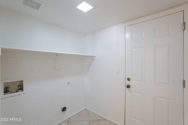 laundry room featuring hookup for a washing machine, light tile patterned floors, visible vents, laundry area, and electric dryer hookup