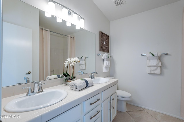 bathroom with tile patterned flooring, visible vents, toilet, and a sink