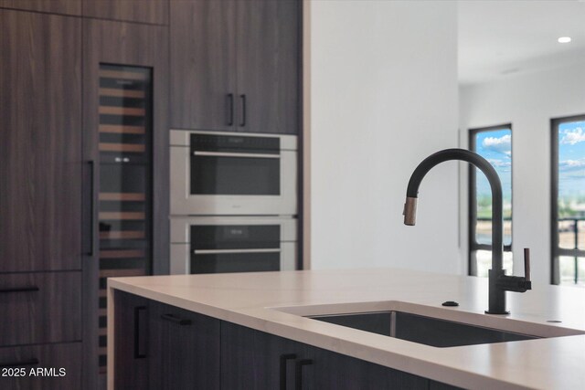 19355 N 73rd Way Unit E-4014, Scottsdale, AZ 85255 - kitchen with double oven, modern cabinets, and light countertops