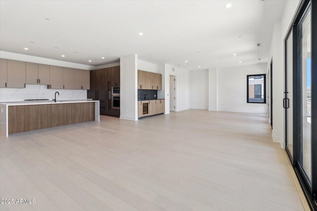 19355 N 73rd Way Unit E-4014, Scottsdale, AZ 85255 - kitchen with open floor plan, modern cabinets, light countertops, a large island, and recessed lighting