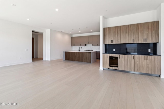 19355 N 73rd Way Unit E-4014, Scottsdale, AZ 85255 - unfurnished living room featuring beverage cooler, light wood-type flooring, and recessed lighting