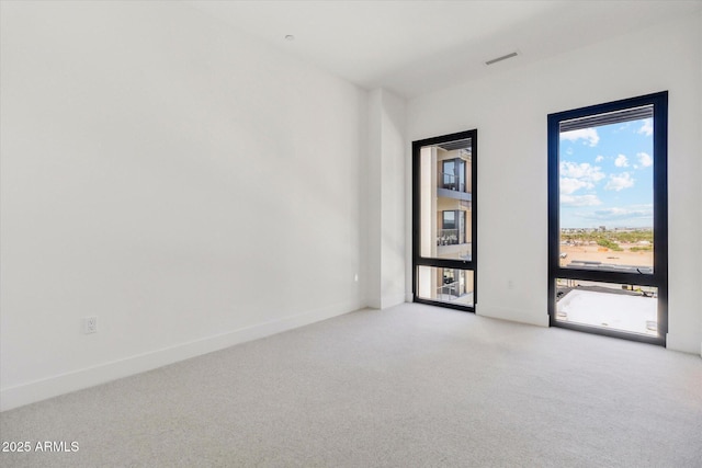 19355 N 73rd Way Unit E-4014, Scottsdale, AZ 85255 - spare room featuring healthy amount of natural light and light colored carpet