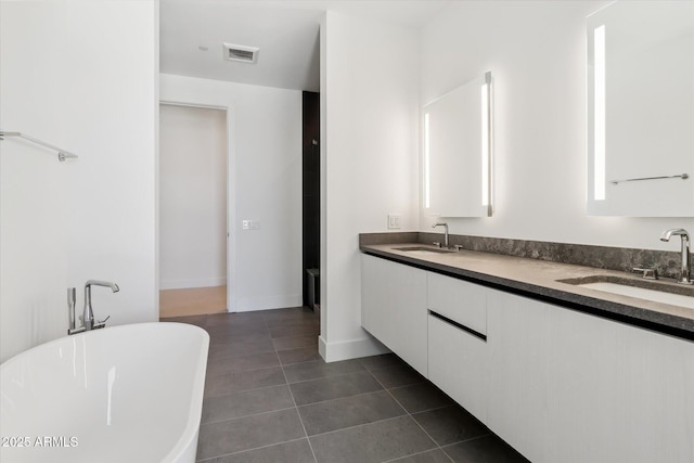 19355 N 73rd Way Unit E-4014, Scottsdale, AZ 85255 - bathroom with a soaking tub, double vanity, and tile patterned flooring
