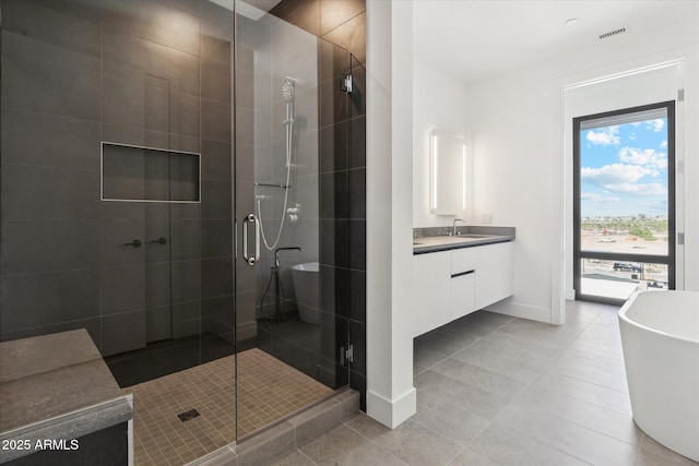 19355 N 73rd Way Unit E-4014, Scottsdale, AZ 85255 - bathroom with a stall shower, vanity, a freestanding tub, and tile patterned floors