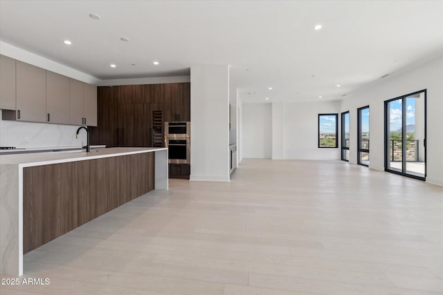 19355 N 73rd Way Unit E-4014, Scottsdale, AZ 85255 - kitchen featuring stainless steel oven, modern cabinets, recessed lighting, light countertops, and open floor plan