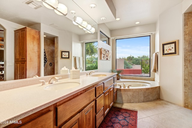 bathroom with tile patterned flooring, shower with separate bathtub, and vanity