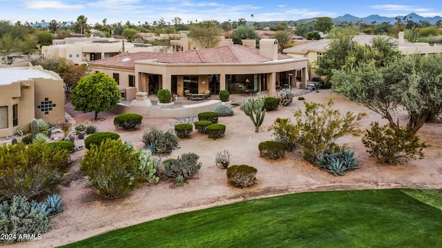 birds eye view of property with a mountain view