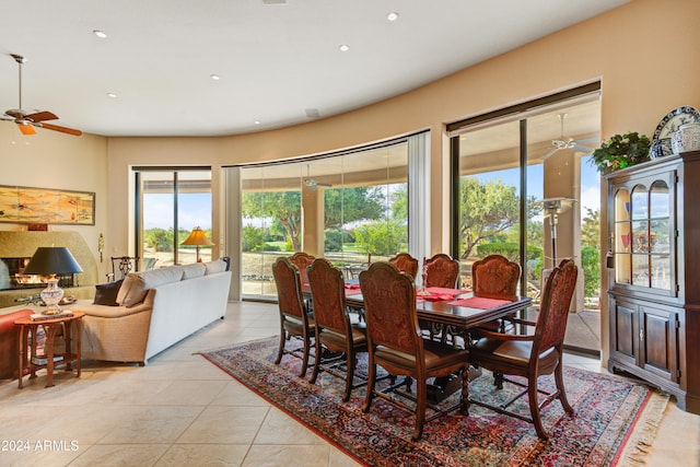 dining space featuring light tile patterned floors and ceiling fan