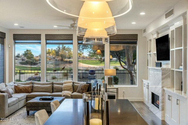 6929 E Montreal Pl, Scottsdale, AZ 85254 - living room featuring visible vents, ceiling fan, light wood-type flooring, a fireplace, and recessed lighting