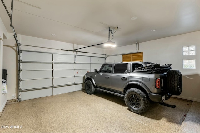 6929 E Montreal Pl, Scottsdale, AZ 85254 - garage with baseboards and a garage door opener