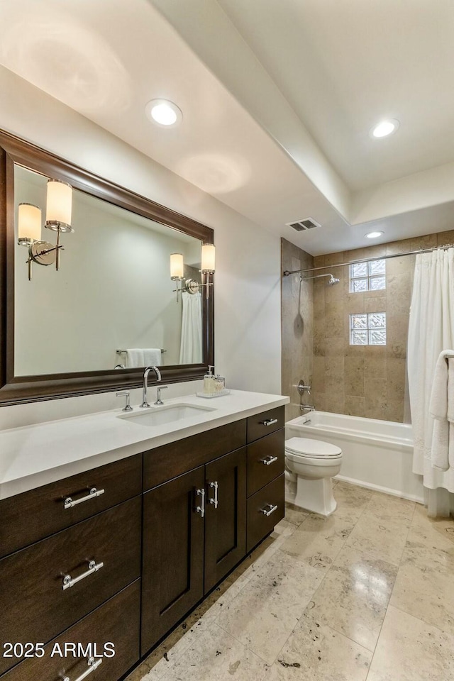 6929 E Montreal Pl, Scottsdale, AZ 85254 - bathroom featuring vanity, visible vents, recessed lighting, toilet, and shower / bath combo with shower curtain