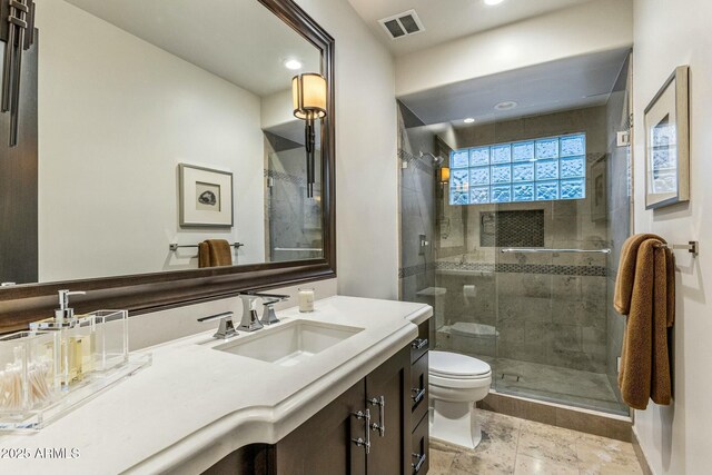 6929 E Montreal Pl, Scottsdale, AZ 85254 - full bath featuring vanity, a stall shower, recessed lighting, toilet, and visible vents
