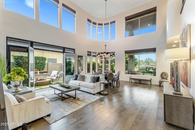 6929 E Montreal Pl, Scottsdale, AZ 85254 - living room featuring baseboards, a notable chandelier, and wood finished floors