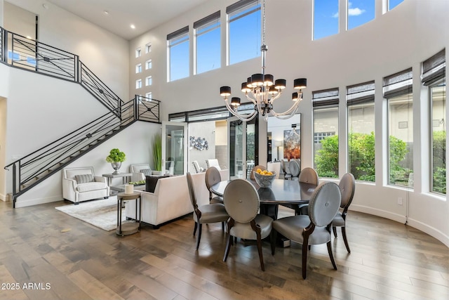 6929 E Montreal Pl, Scottsdale, AZ 85254 - dining area with recessed lighting, a chandelier, stairway, wood finished floors, and baseboards