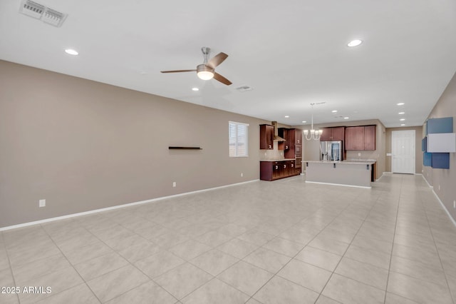 10160 E Harvest Rd, Florence, AZ 85132 - unfurnished living room featuring a ceiling fan, recessed lighting, baseboards, and a chandelier
