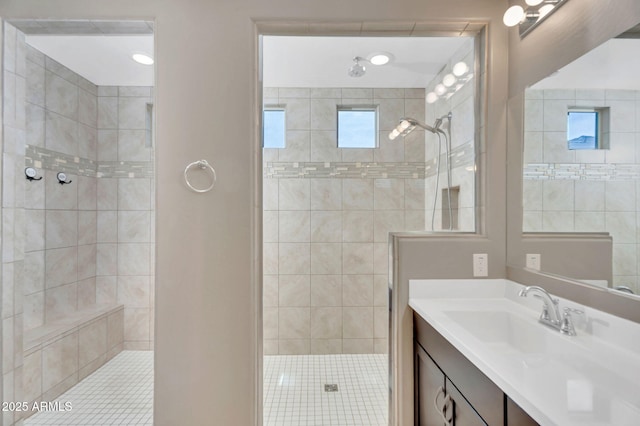 10160 E Harvest Rd, Florence, AZ 85132 - bathroom featuring vanity, a tile shower, and tile patterned flooring