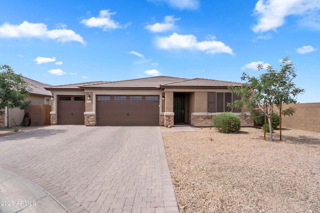 10160 E Harvest Rd, Florence, AZ 85132 - prairie-style home featuring stone siding, stucco siding, a garage, decorative driveway, and a tiled roof