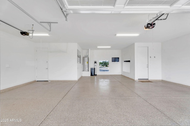 10160 E Harvest Rd, Florence, AZ 85132 - garage featuring electric water heater, a garage door opener, and baseboards