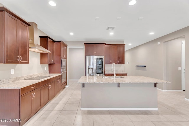 10160 E Harvest Rd, Florence, AZ 85132 - kitchen with stainless steel appliances, a sink, an island with sink, light stone countertops, and light tile patterned floors