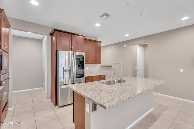 10160 E Harvest Rd, Florence, AZ 85132 - kitchen featuring stainless steel refrigerator with ice dispenser, a sink, light tile patterned floors, light stone countertops, and recessed lighting