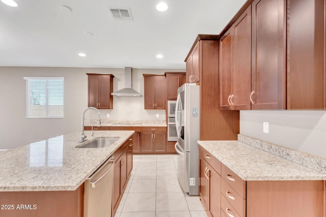 10160 E Harvest Rd, Florence, AZ 85132 - kitchen featuring wall chimney range hood, a sink, stainless steel appliances, recessed lighting, and an island with sink