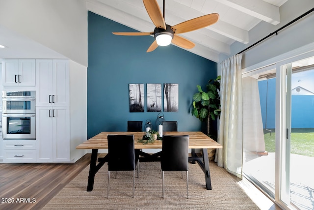 dining area featuring lofted ceiling with beams, wood finished floors, and a ceiling fan