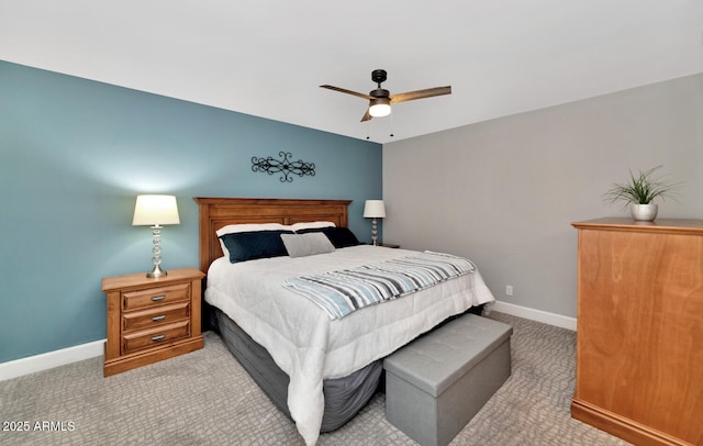 bedroom with a ceiling fan, carpet flooring, and baseboards