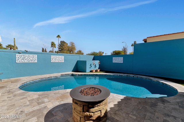 view of pool with a patio, a fenced backyard, and a fenced in pool