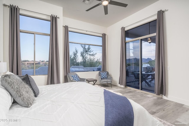 28437 N 112th Way, Scottsdale, AZ 85262 - bedroom with access to outside, a ceiling fan, visible vents, baseboards, and wood finished floors