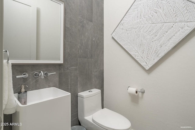 28437 N 112th Way, Scottsdale, AZ 85262 - bathroom featuring tile walls, toilet, and decorative backsplash
