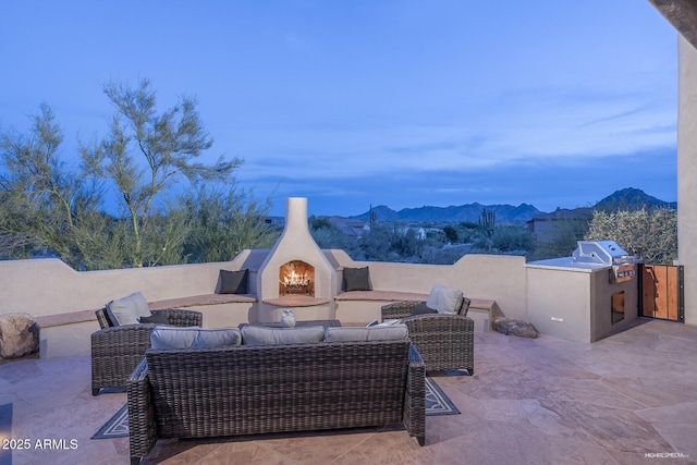 28437 N 112th Way, Scottsdale, AZ 85262 - view of patio / terrace featuring a mountain view, an outdoor kitchen, an outdoor living space with a fireplace, and a grill