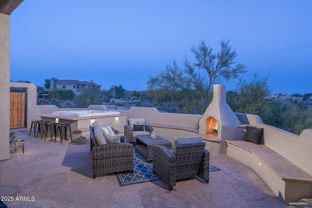 28437 N 112th Way, Scottsdale, AZ 85262 - view of patio / terrace featuring outdoor dry bar and a lit fireplace