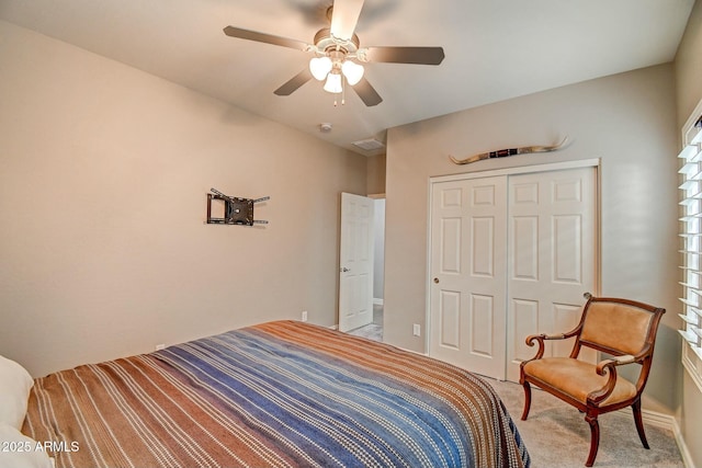 10249 E Kinetic Dr, Mesa, AZ 85212 - bedroom featuring light colored carpet, a closet, a ceiling fan, and baseboards