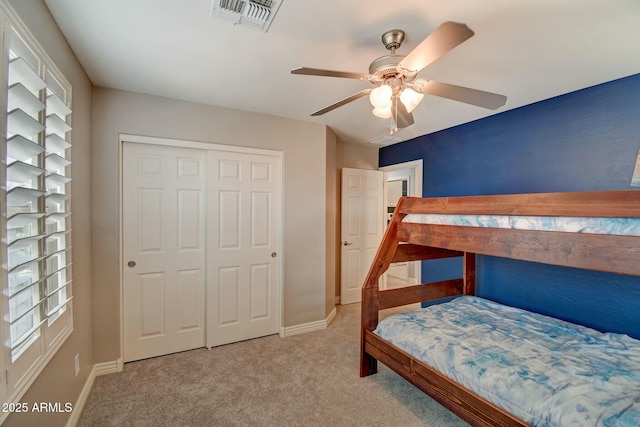 10249 E Kinetic Dr, Mesa, AZ 85212 - carpeted bedroom with baseboards, a closet, and a ceiling fan