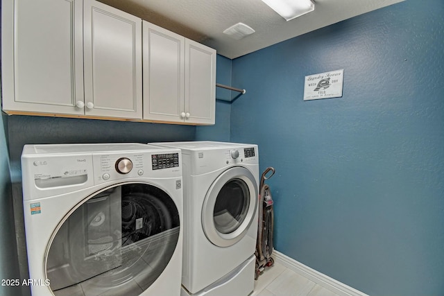 10249 E Kinetic Dr, Mesa, AZ 85212 - laundry room featuring cabinet space, washing machine and clothes dryer, baseboards, and tile patterned flooring