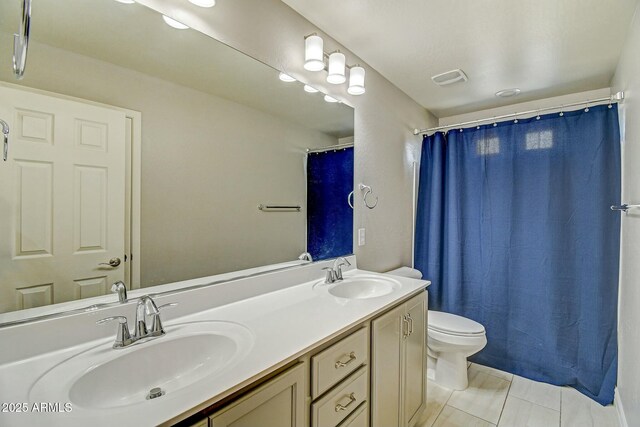 10249 E Kinetic Dr, Mesa, AZ 85212 - bathroom featuring toilet, double vanity, and tile patterned flooring