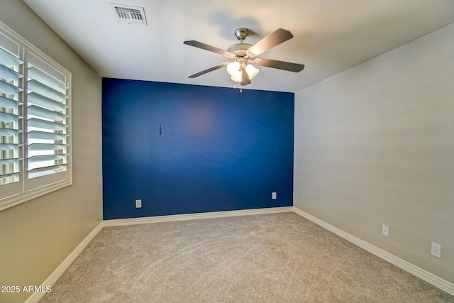 10249 E Kinetic Dr, Mesa, AZ 85212 - spare room featuring a ceiling fan, carpet floors, and baseboards