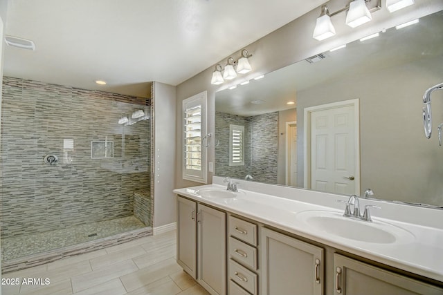 10249 E Kinetic Dr, Mesa, AZ 85212 - full bathroom with tiled shower, double vanity, tile patterned flooring, and recessed lighting