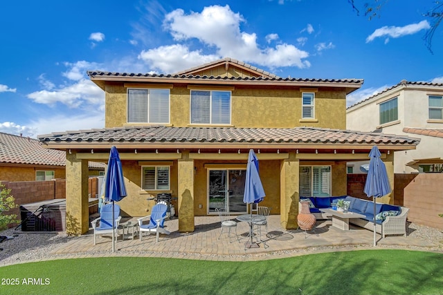 10249 E Kinetic Dr, Mesa, AZ 85212 - rear view of property featuring outdoor lounge area, fence, a tiled roof, and a patio