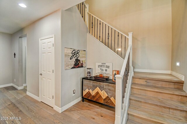 10249 E Kinetic Dr, Mesa, AZ 85212 - staircase featuring wood finished floors, baseboards, and recessed lighting