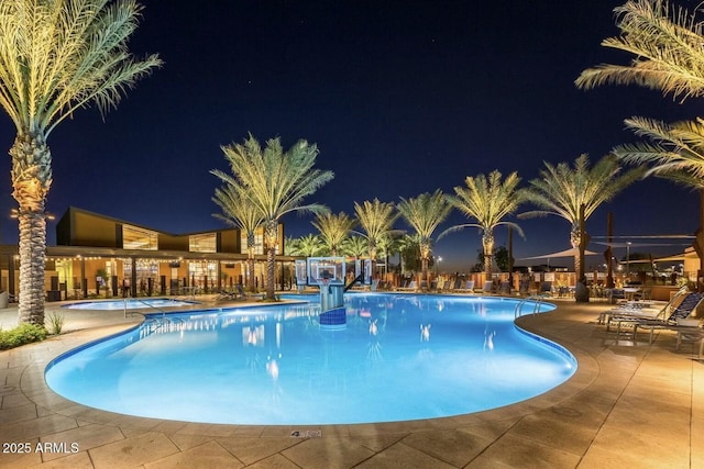 10249 E Kinetic Dr, Mesa, AZ 85212 - pool at twilight with a community pool and a patio