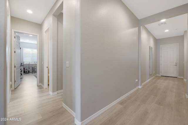 corridor featuring light wood-style floors, baseboards, recessed lighting, and visible vents