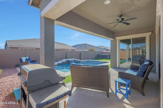 view of patio / terrace with a fenced in pool, a fenced backyard, ceiling fan, and outdoor lounge area