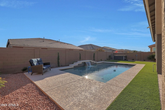 view of swimming pool with a lawn, a fenced in pool, a fenced backyard, and a patio area