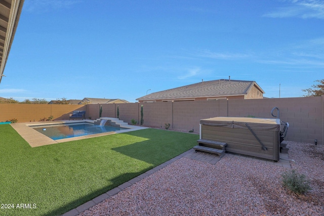 view of yard with a fenced in pool, a fenced backyard, and a hot tub