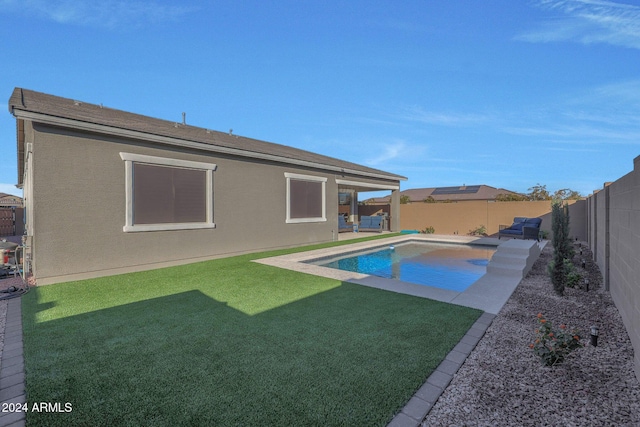 view of swimming pool featuring a lawn, a fenced backyard, a patio area, and a fenced in pool