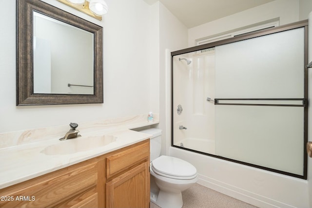 full bathroom featuring vanity, bath / shower combo with glass door, and toilet