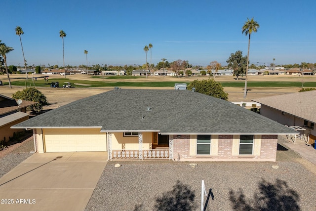 view of front of home featuring covered porch and a garage