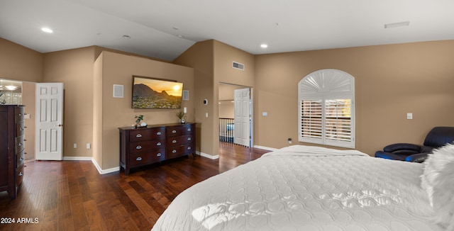 bedroom with dark wood-type flooring and vaulted ceiling